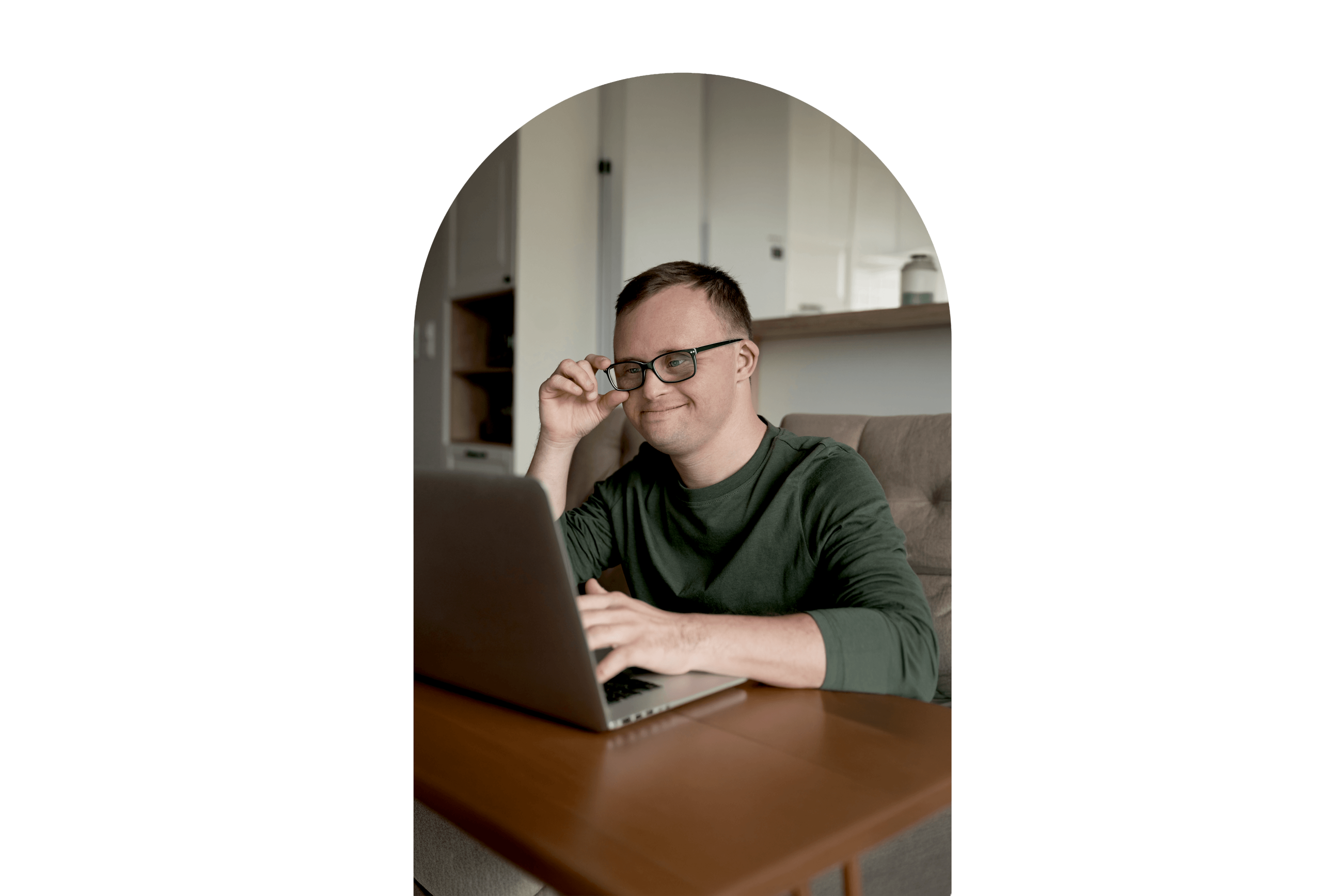 cheerful-adult-man-with-down-syndrome-using-laptop-home(4)-tinified