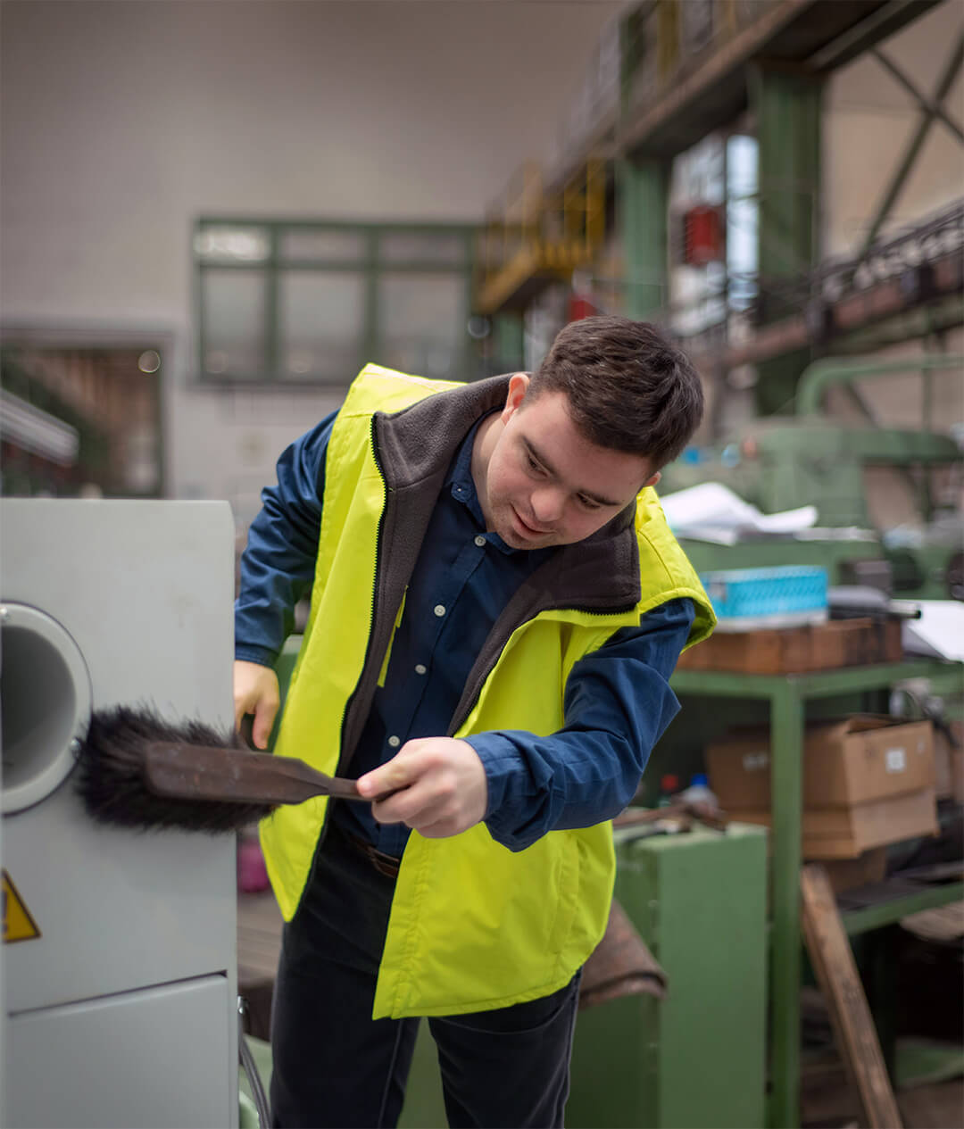Man with Down's Syndrome works at a factory