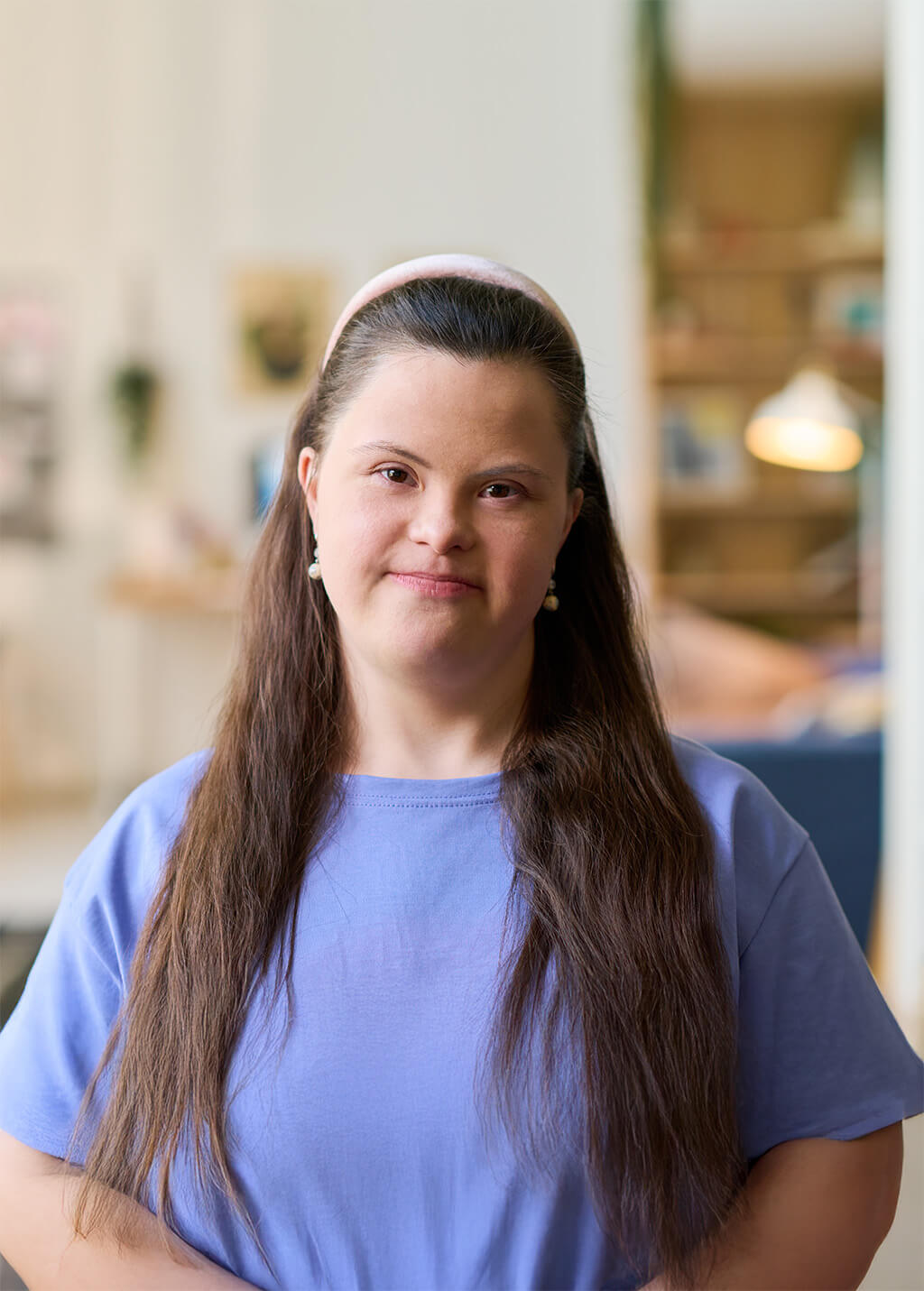 Woman with Down's Syndrome wearing a purple shirt